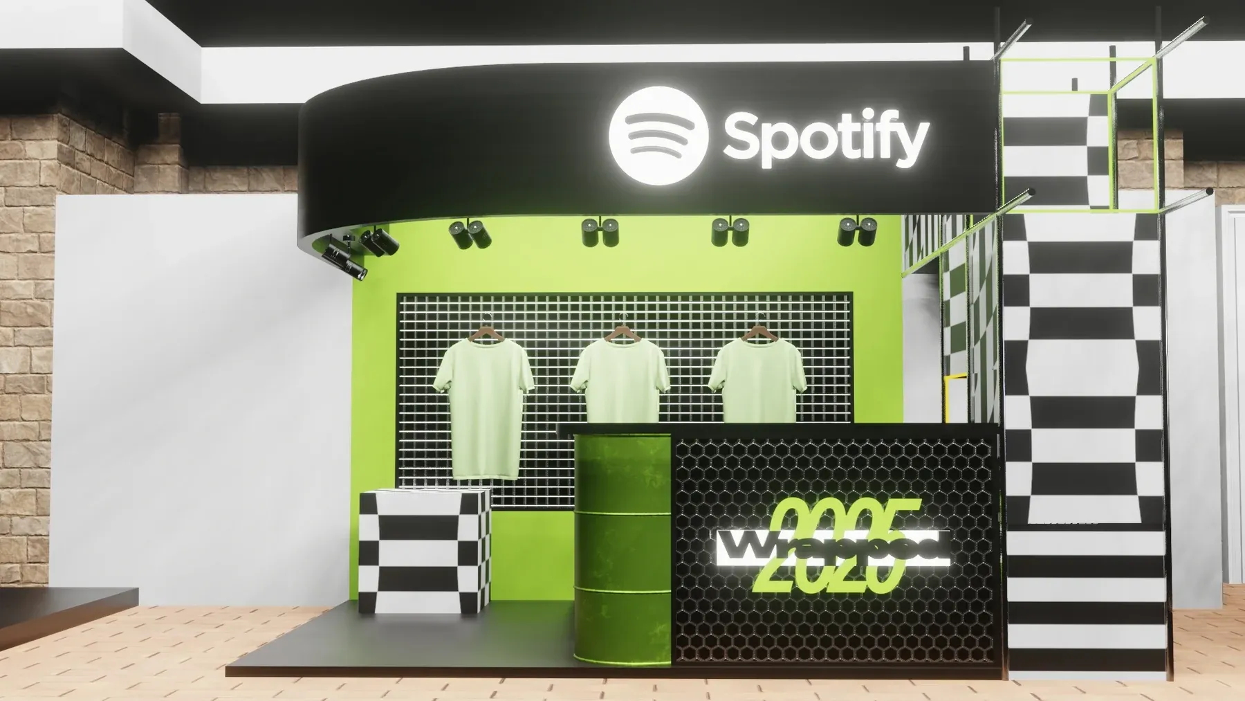 Merchandise stand with green T-shirts above a chequered counter, under a black Spotify canopy.