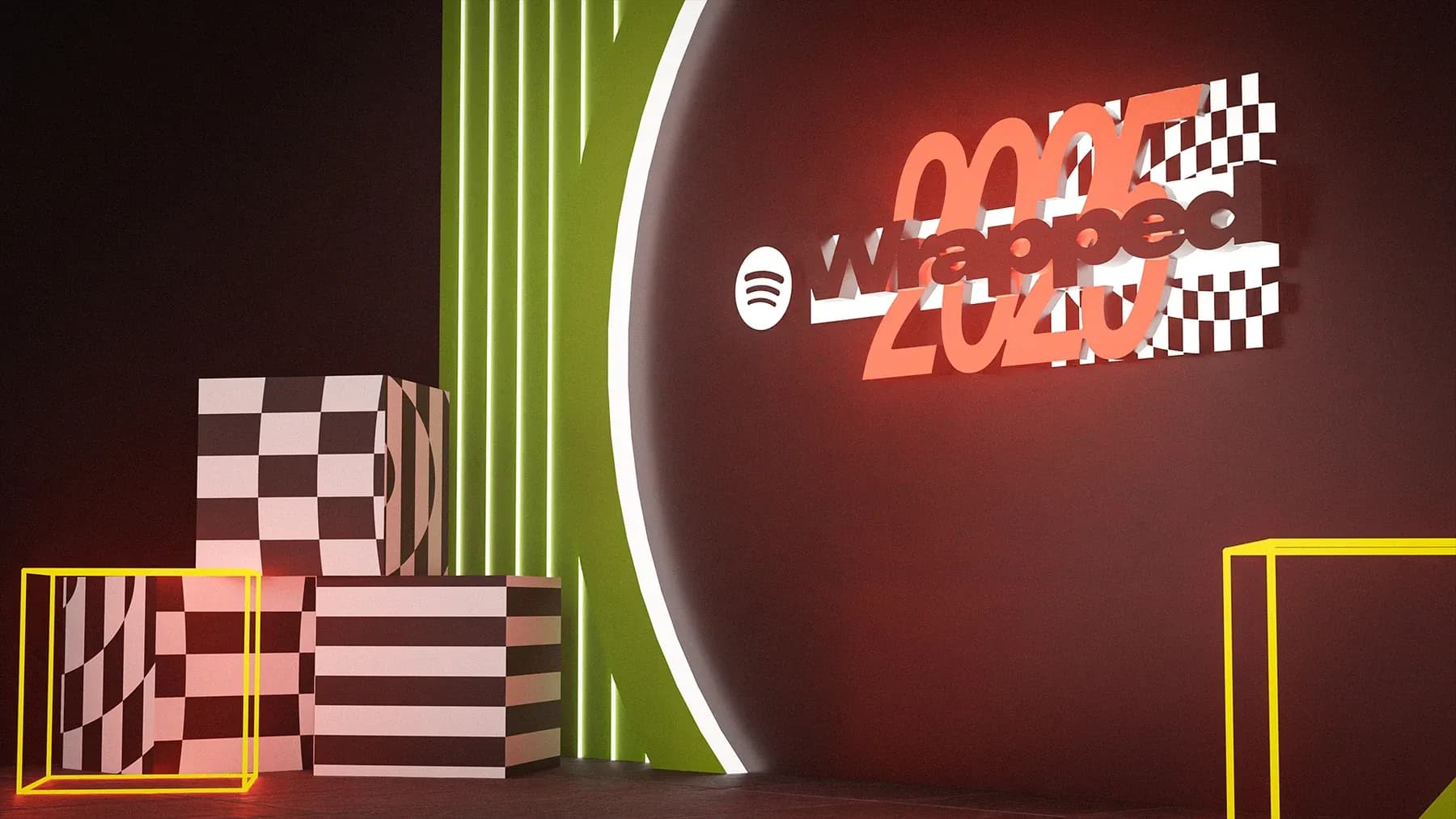 Dark event space with a glowing red Wrapped 2025 wall, chequered blocks and a green neon stripe.