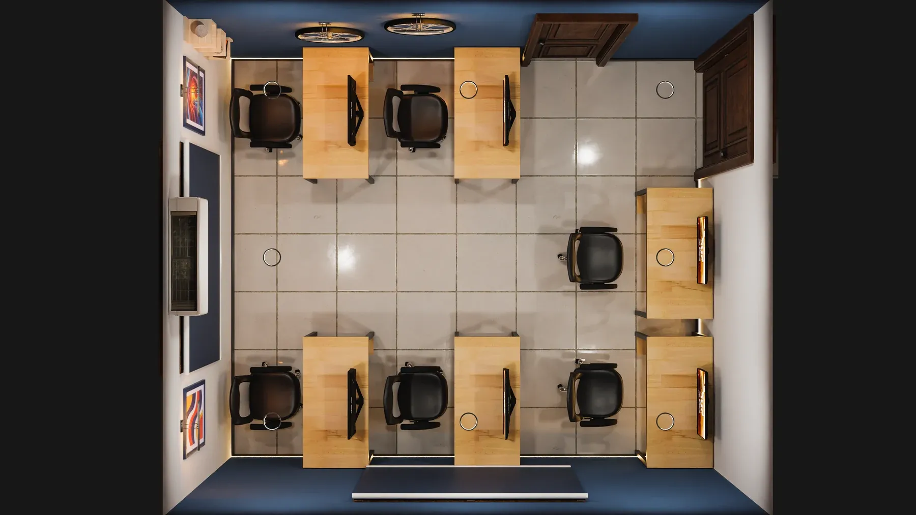 Top-down view of the workroom showing the desks, chairs and door.